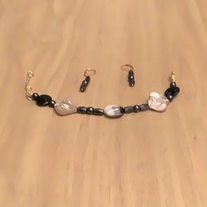 6 3/4 inch adjustable bracelet. Earrings are 1/ 1”long.Nickel free metal on both